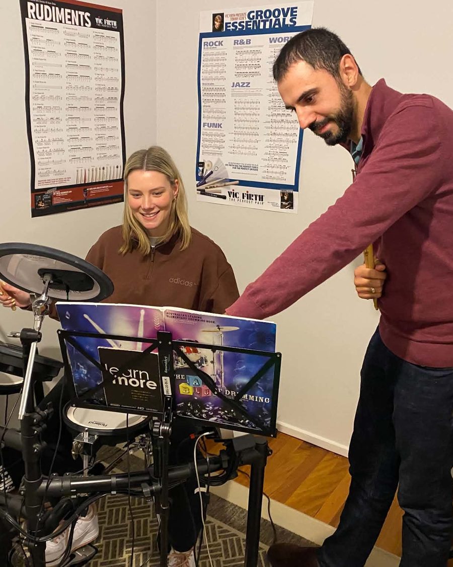 Peter guiding an adult student through a lesson at the drum kit in his Melbourne home studio