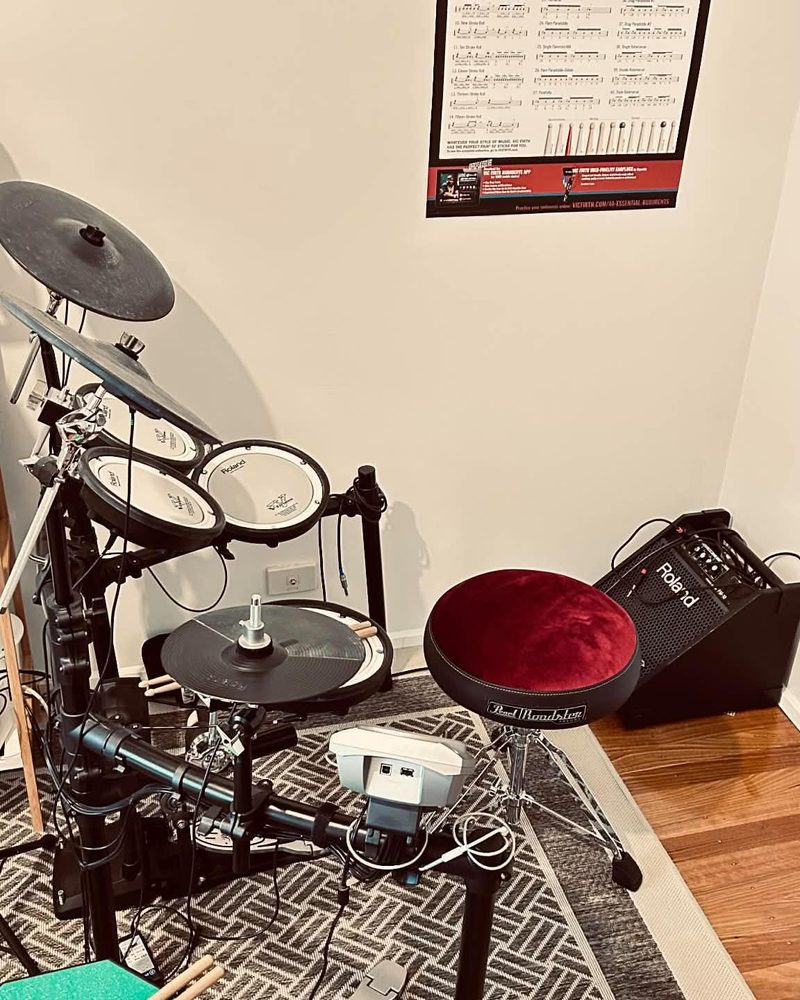 The teaching room with kit, practice pad, amp and drum stool ready for a lesson